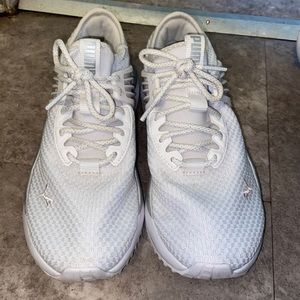 White women’s Puma shoes. Size 7.5